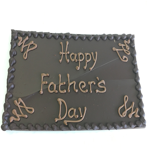 Chocolate plaque with happy fathers day in icing